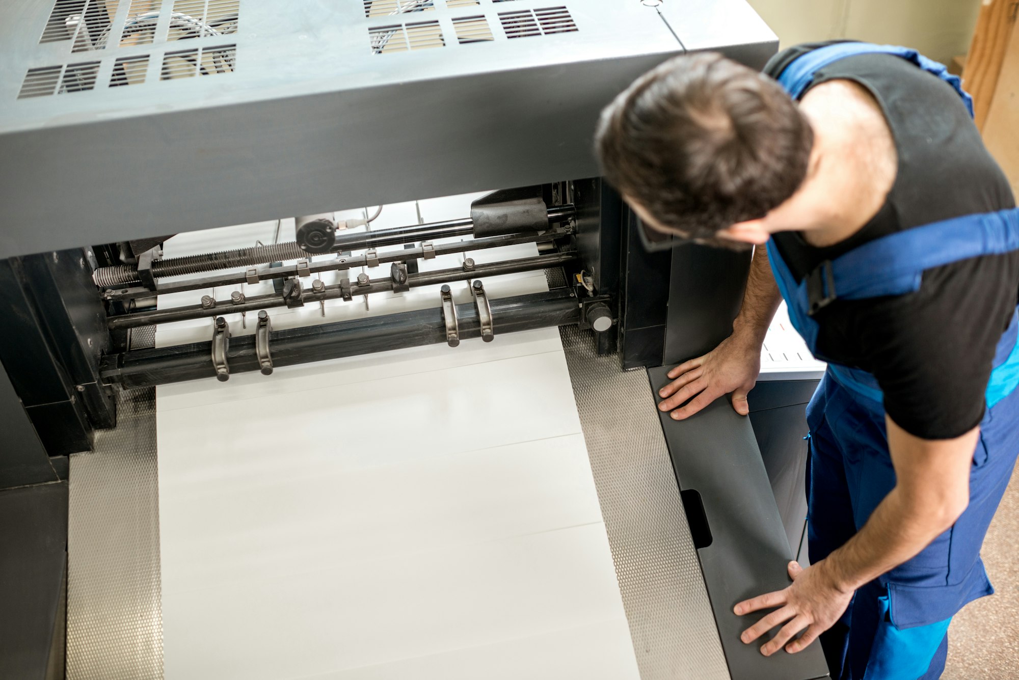 Man working at the printing manufacturing